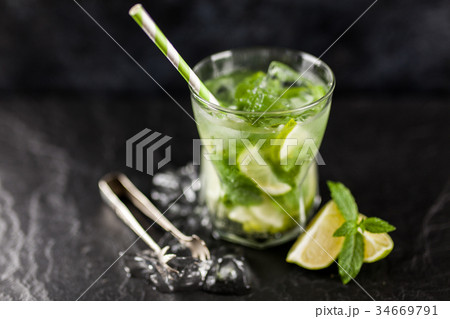 Mojito cocktail on dark background Mojito cocktail on dark background 34669791