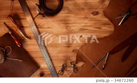 Leather craft. Tanner's tools on grey wooden 34672260