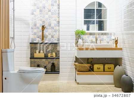 Modern bathroom with bright tiles with toilet Modern bathroom with bright tiles with toilet 34672807