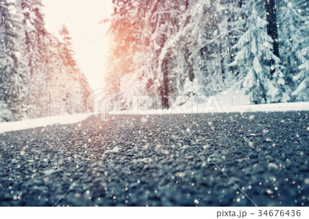 Asphalt road in snowy winter on beautiful day 34676436