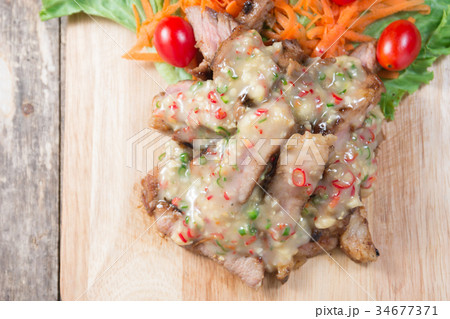 Roasted pork and sauce with salad Roasted pork and sauce with salad 34677371