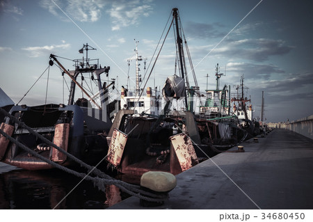 Industrial fishing boats are moored in port Industrial fishing boats are moored in port 34680450