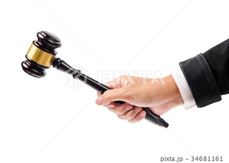wooden gavel in hand. 34681161