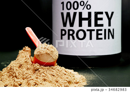 Whey Protein Powder in measuring scoop. Whey Protein Powder in measuring scoop. 34682983
