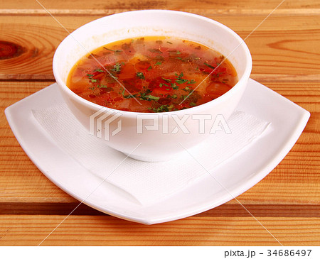 Bowl of Bright Red Creamy Tomato Soup with Yogurt 34686497