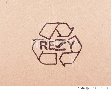 torn out piece of cardboard with recycle symbol torn out piece of cardboard with recycle symbol 34687004