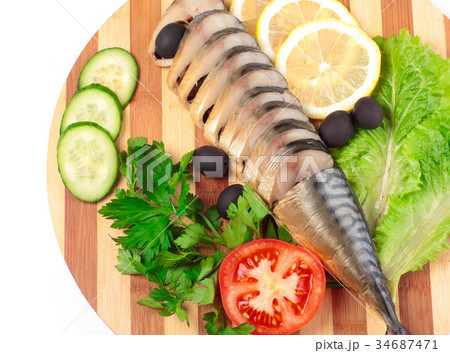 sliced herring on wooden plate 34687471