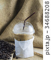 Iced coffee with beans. 34688208