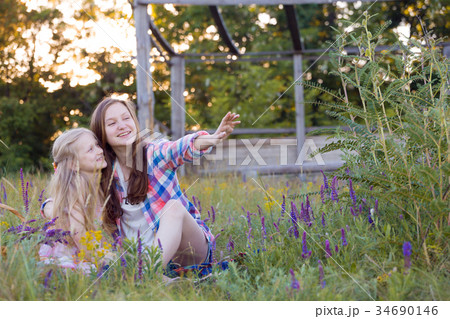 Beautiful girl on the meadow 34690146