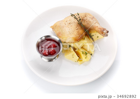 Delicious lunch. Potatoes with chicken and sauce Delicious lunch. Potatoes with chicken and sauce 34692892