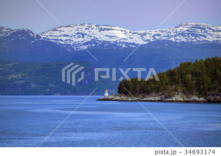 lighthouse on a fjord shore 34693174