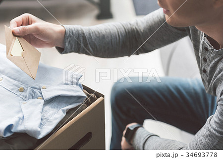 Male holding letter in arm 34693778