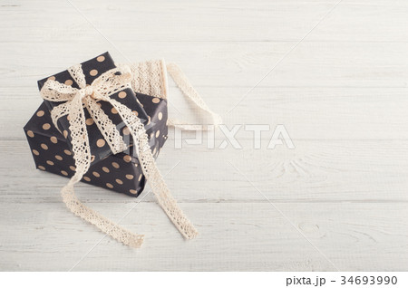Gift boxes and lace ribbon Gift boxes and lace ribbon 34693990