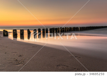 Baltic sea at beautiful sunrise in Poland beach. Baltic sea at beautiful sunrise in Poland beach. 34695250