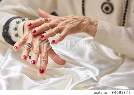 Senior manicured hands with jewelry. Senior manicured hands with jewelry. 34695372