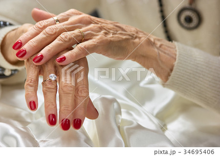 Old woman beautiful hands with rings. 34695406