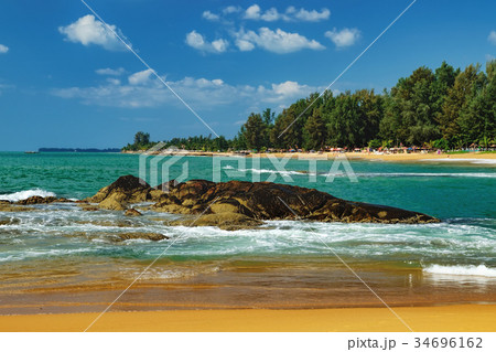 View of blue sea with stones under the blue sky View of blue sea with stones under the blue sky 34696162