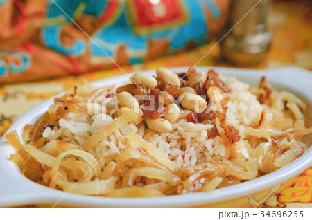 Pulao with ghee fried nuts and caramelized onions Pulao with ghee fried nuts and caramelized onions 34696255