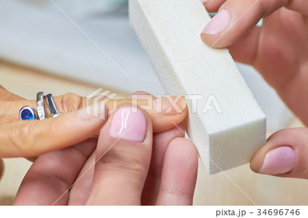 Manicure nail buffering close up. 34696746