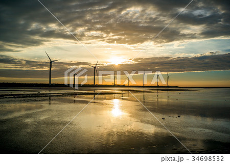sillouette of Wind turbine array at Gaomei Wetland sillouette of Wind turbine array at Gaomei Wetland 34698532