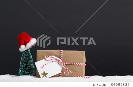 Gift box with miniature Christmas tree Gift box with miniature Christmas tree 34699382