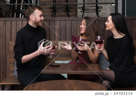 Joyful company conversation in bar Joyful company conversation in bar 34703314