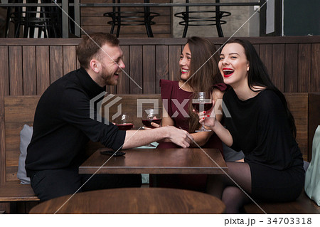 Funny company conversation in bar Funny company conversation in bar 34703318