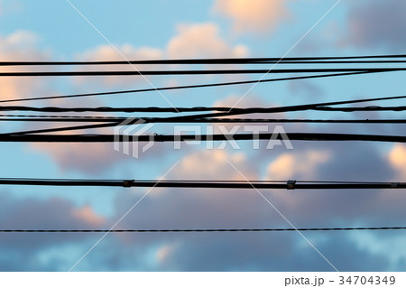 Electric wires at sunset as an background 34704349