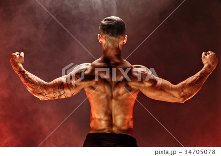 Back view of Unrecognizable man, strong muscles Back view of Unrecognizable man, strong muscles 34705078