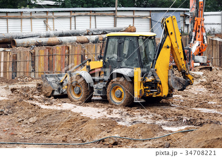 Tractor excavator with bucket rides running 34708221