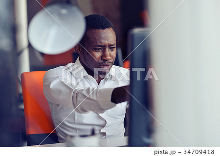 Disappointed African businessman is dazed and Disappointed African businessman is dazed and 34709418