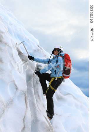 The girl climbing on the glacier 34709830