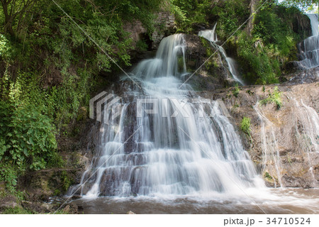 High mountain waterfall 34710524