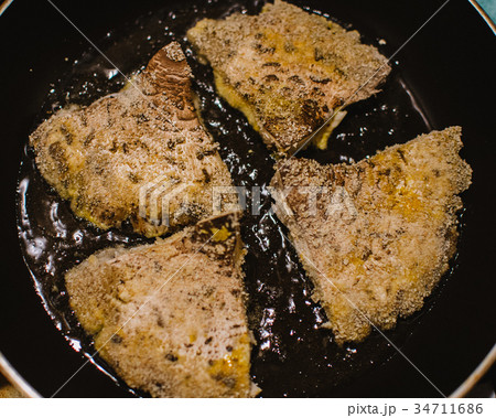 mushroom chops from Macrolepiota procera on a pan mushroom chops from Macrolepiota procera on a pan 34711686