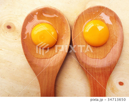 York eggs on wooden ladle on wooden background York eggs on wooden ladle on wooden background 34713650