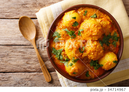Indian fried potatoes Dum aloo in curry sauce Indian fried potatoes Dum aloo in curry sauce 34714967