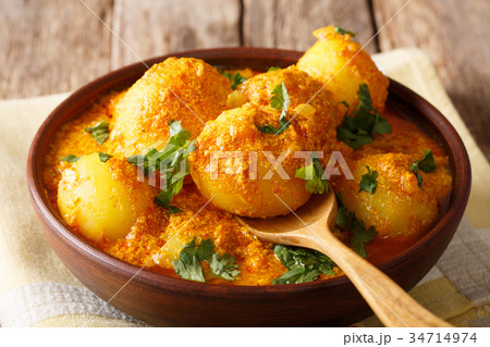 Delicious Indian Potato Dum aloo in curry sauce Delicious Indian Potato Dum aloo in curry sauce 34714974