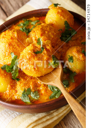 Indian fried potatoes Dum aloo in curry sauce 34714979