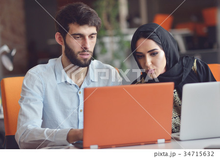 Multiracial contemporary business people working 34715632