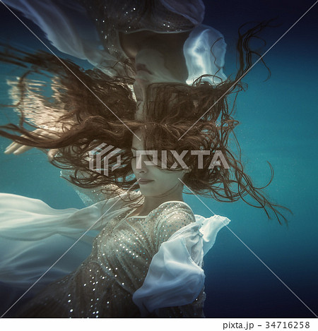 Girl in white dress underwater Girl in white dress underwater 34716258