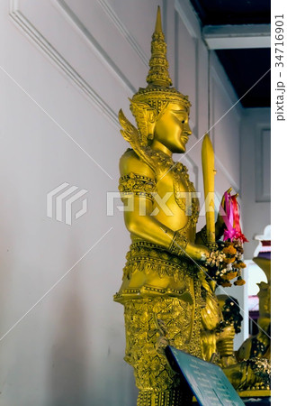 Golden Buddha statue standing Golden Buddha statue standing 34716901