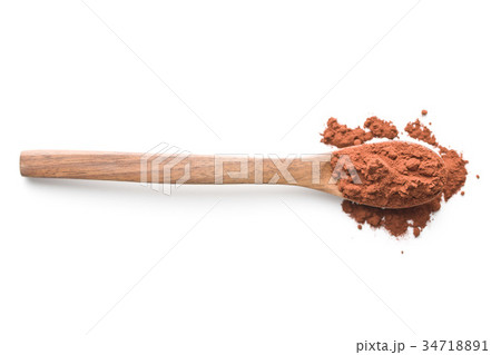 Tasty cocoa powder in wooden spoon. 34718891