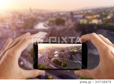 Travel concept. Hands making photo of TBILISI 34718979