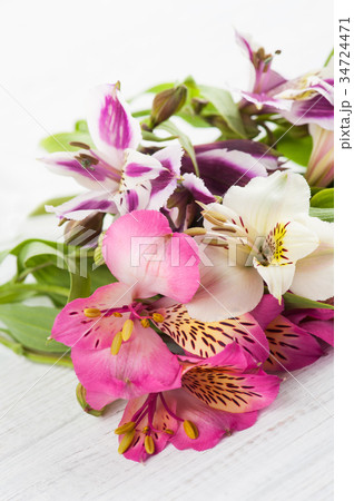 Alstromeria flowers on wooden background 34724471