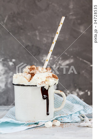 cocoa with cream and cinnamon 34728535