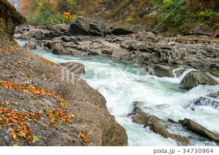 Fall landscape with mountain river and forest Fall landscape with mountain river and forest 34730964