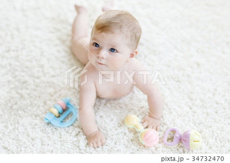 Cute baby girl playing with colorful pastel Cute baby girl playing with colorful pastel 34732470