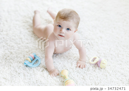 Cute baby girl playing with colorful pastel Cute baby girl playing with colorful pastel 34732471