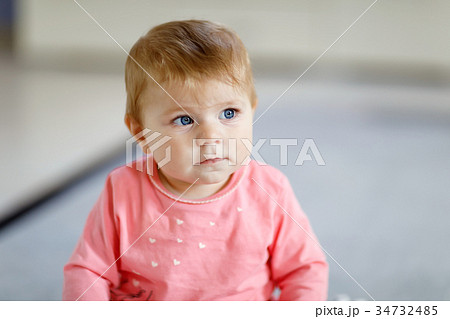 Portrait of cute beautiful baby girl smiling 34732485