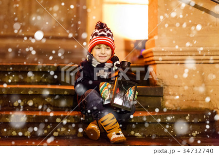 Little cute kid boy with with a light lantern on Little cute kid boy with with a light lantern on 34732740